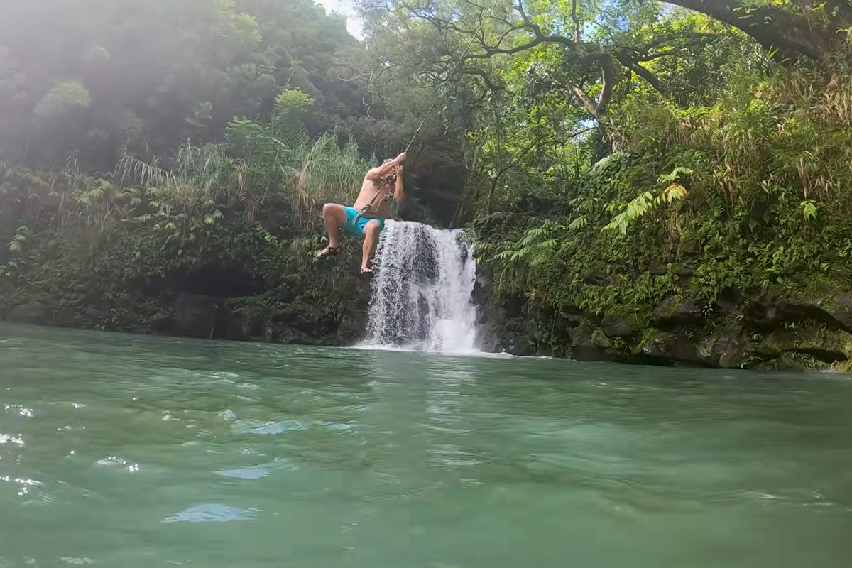 A cliff jump into a jungle pool