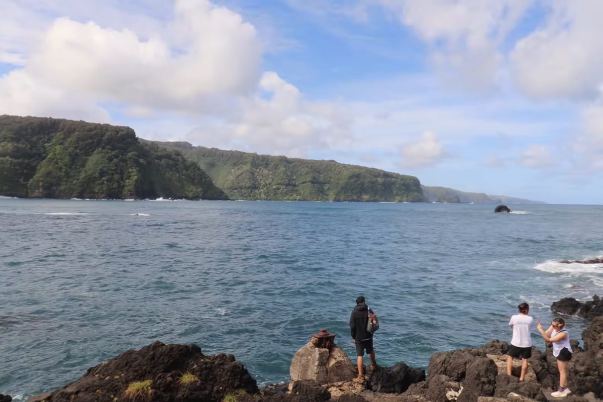 A couple on the lava rock coast